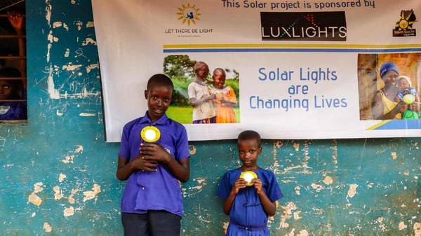 Africa two students with donated solar lights